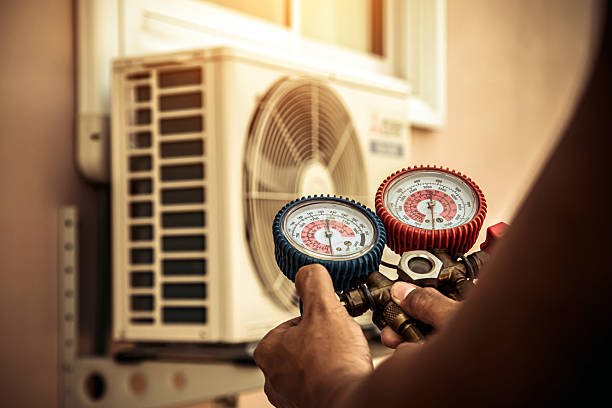 Professional Air Conditioning Service technician working in South Lancaster, MA